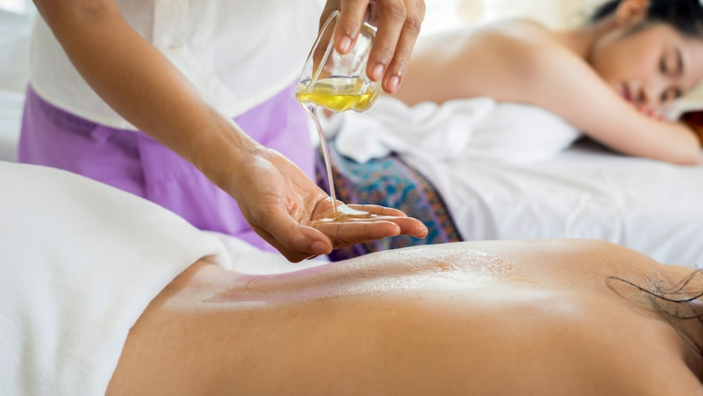 A woman getting a body massage.
