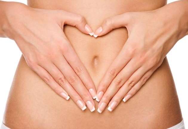 A woman feeling less bloated following a colon hydrotherapy.