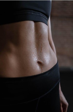 An image of a close up view of a person’s abs 