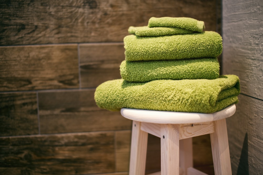 An image of towels on a stool
