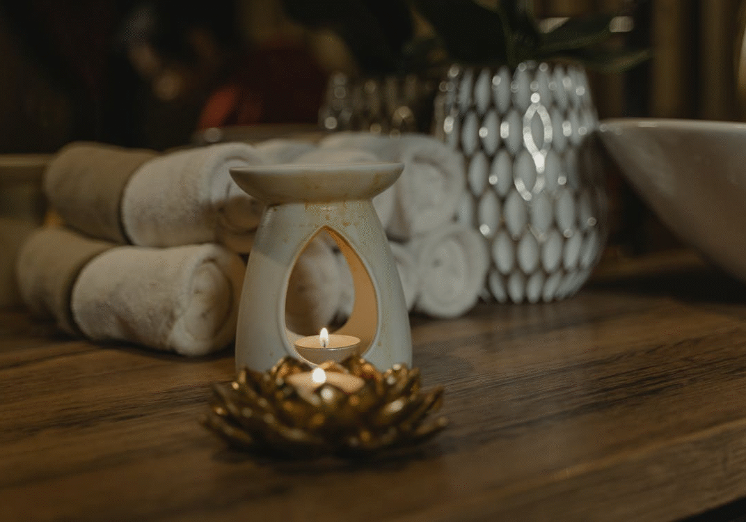An image of rolled towels on a wooden table