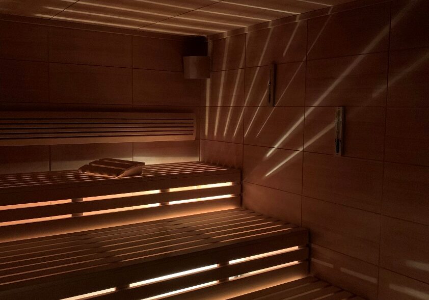 a view of a modern sauna with benches